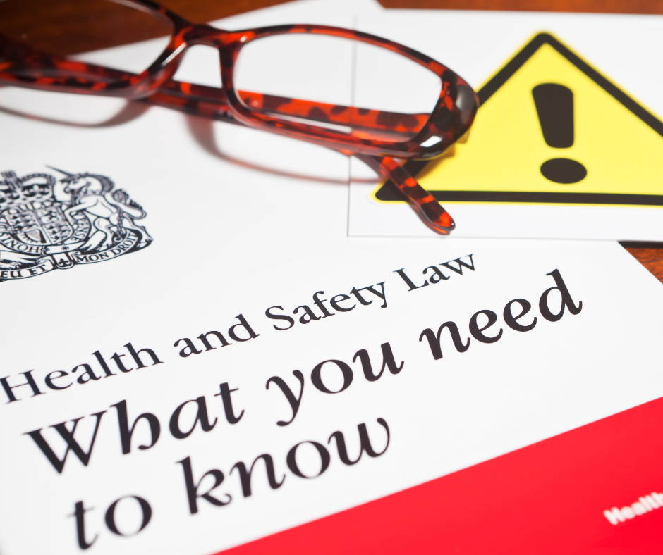 Office paperwork and folders illustrating Health and Safety administration